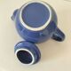 Vintage deep blue teapot, minimalist round shape.