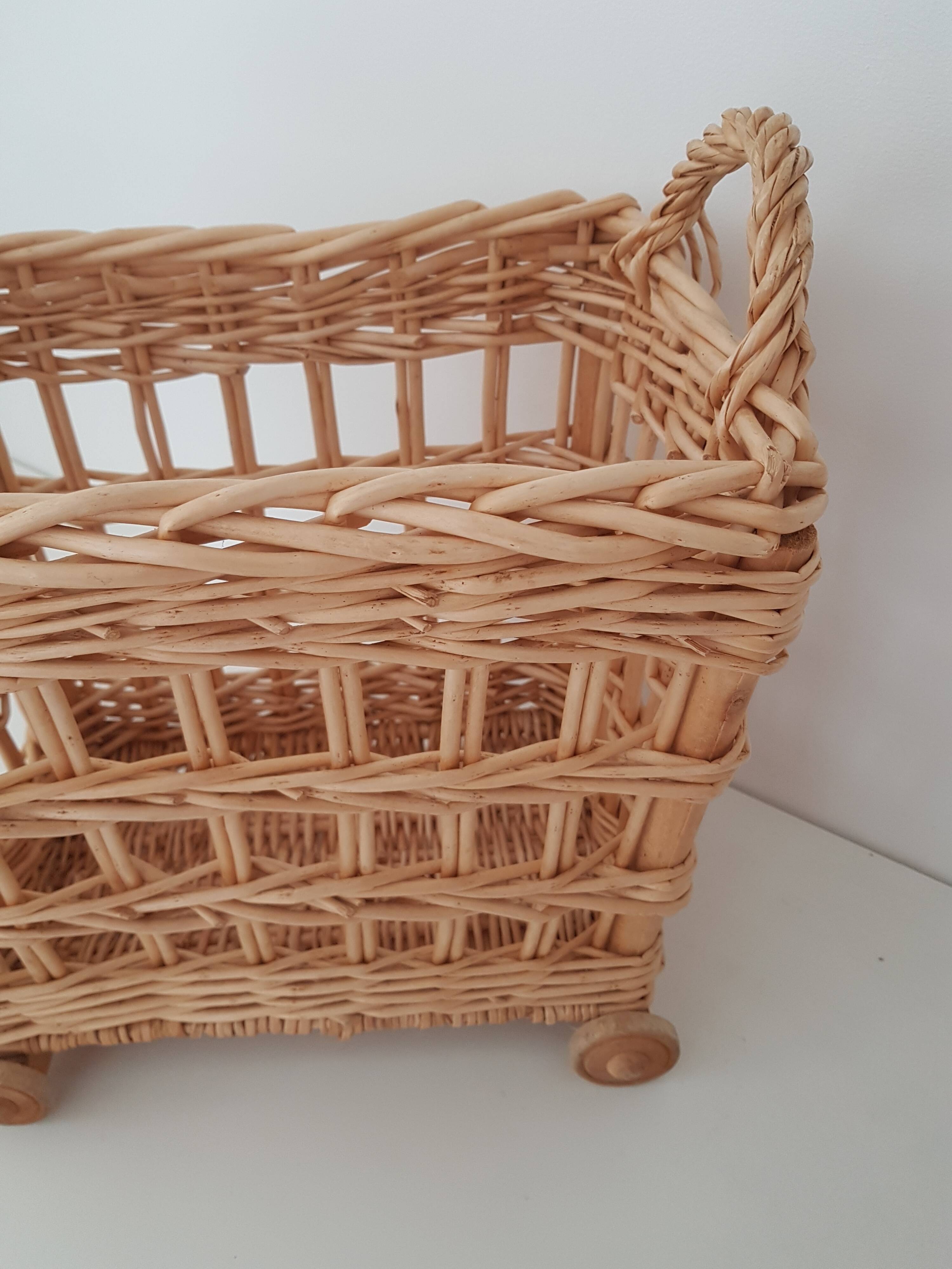 Vintage wicker basket on wheels - children's toy trolley