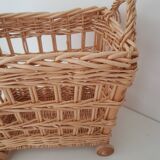Vintage wicker basket on wheels - children's toy trolley