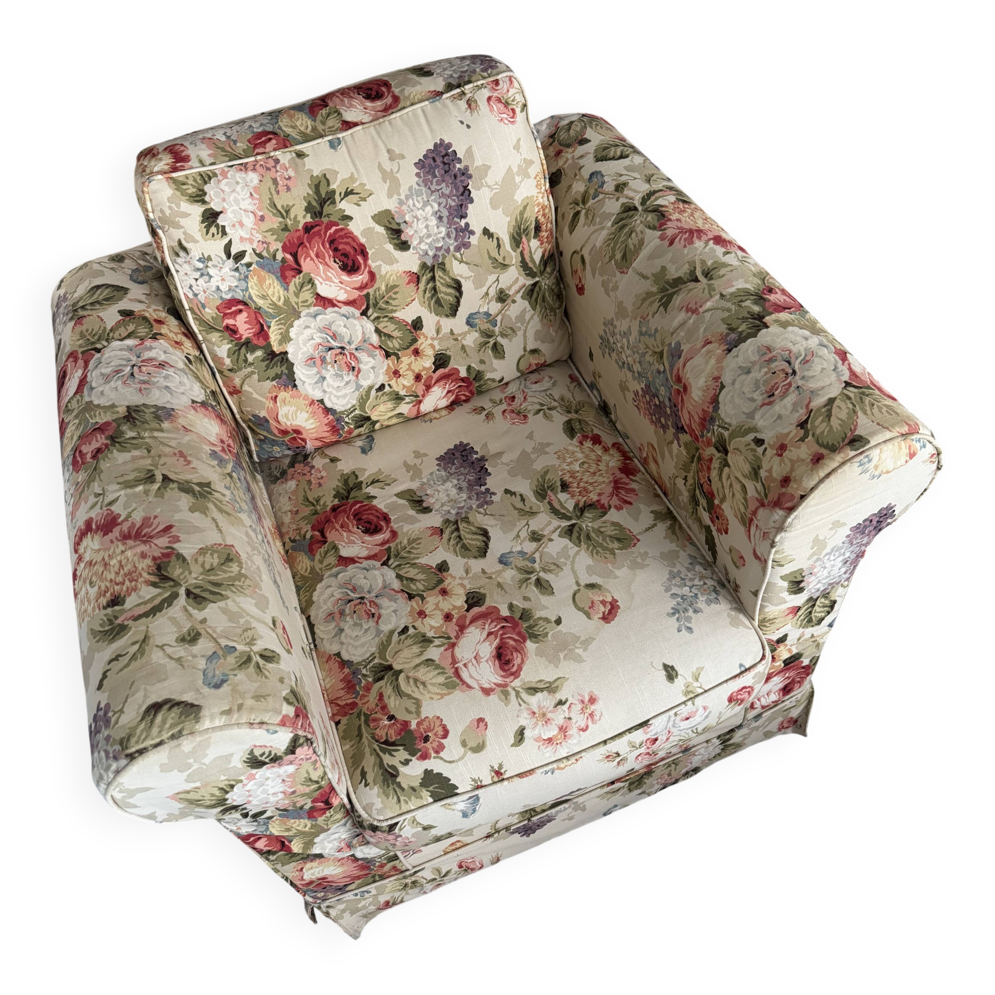 Deep, very comfortable armchair in floral fabric.