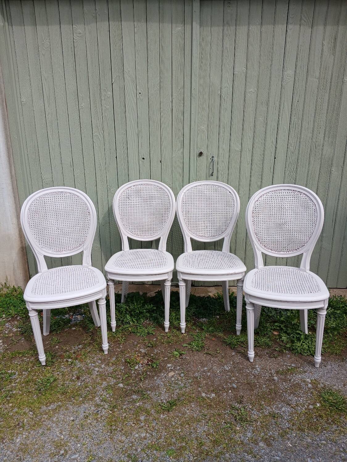 4 old wooden and cane chairs