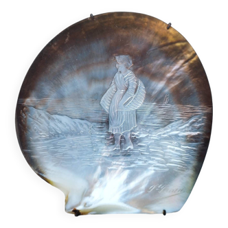 Mother-of-pearl shell carved fisherman on foot