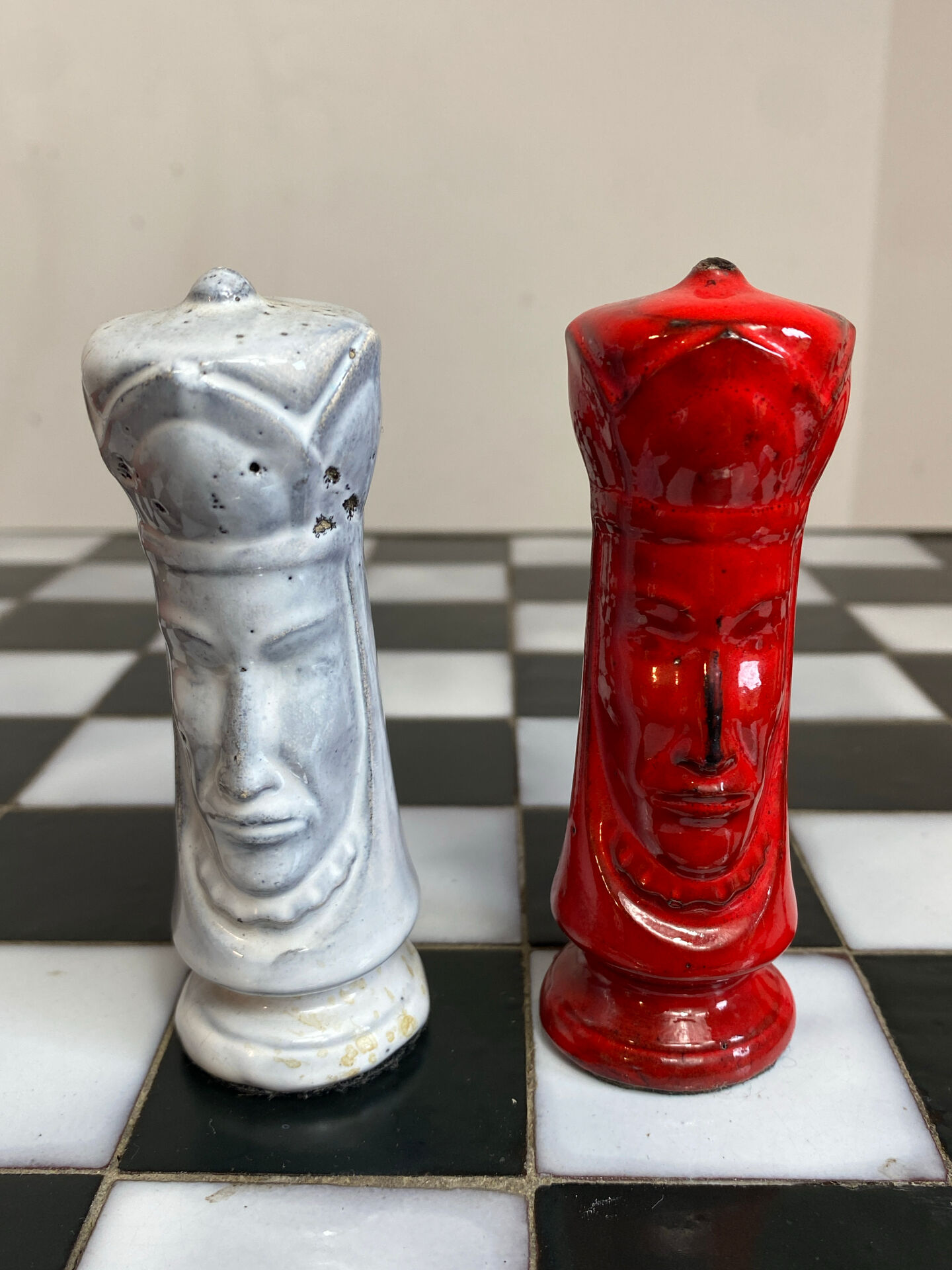 Chess set with ceramic board and pieces.