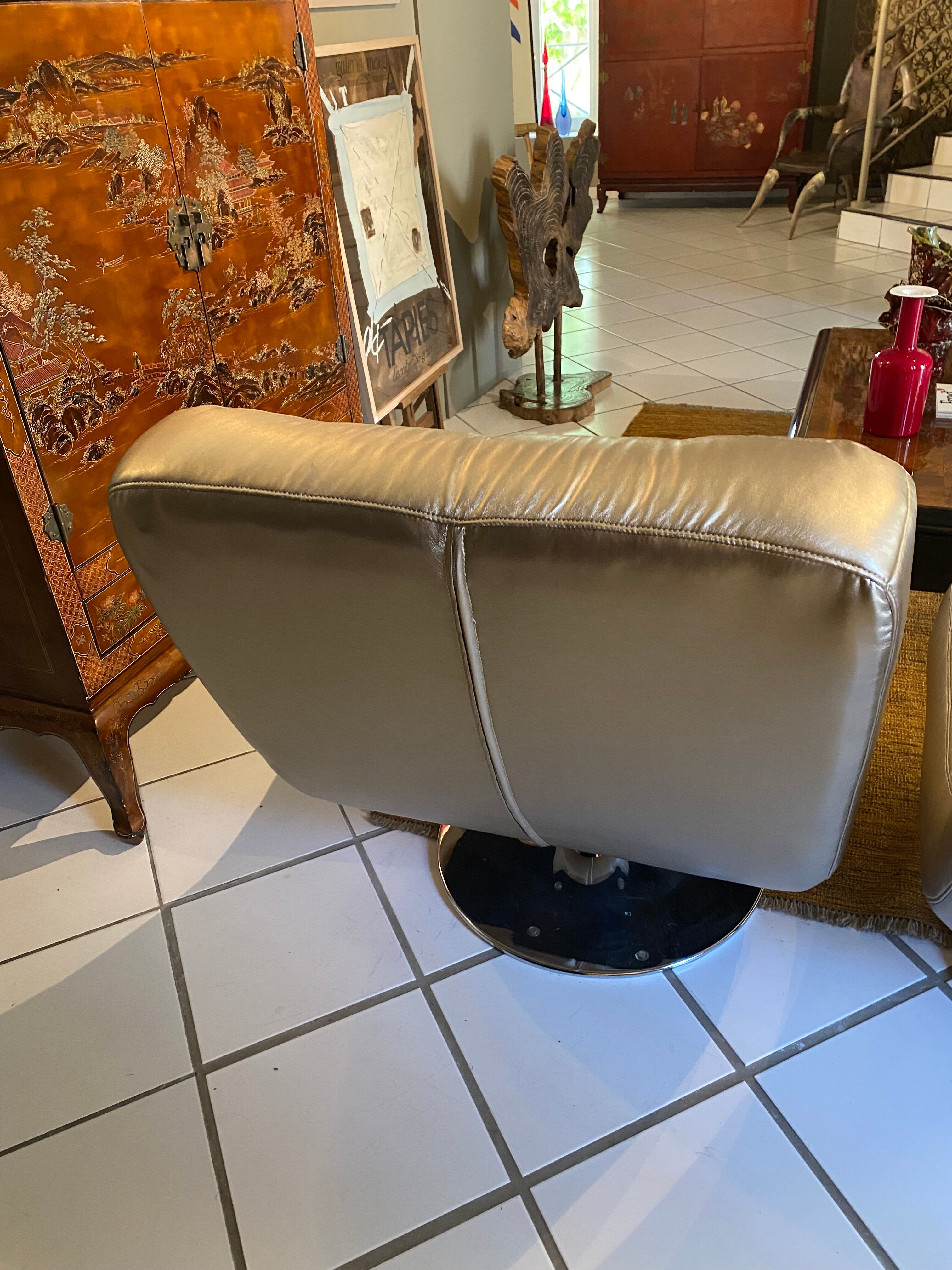 Pair of leather design armchairs