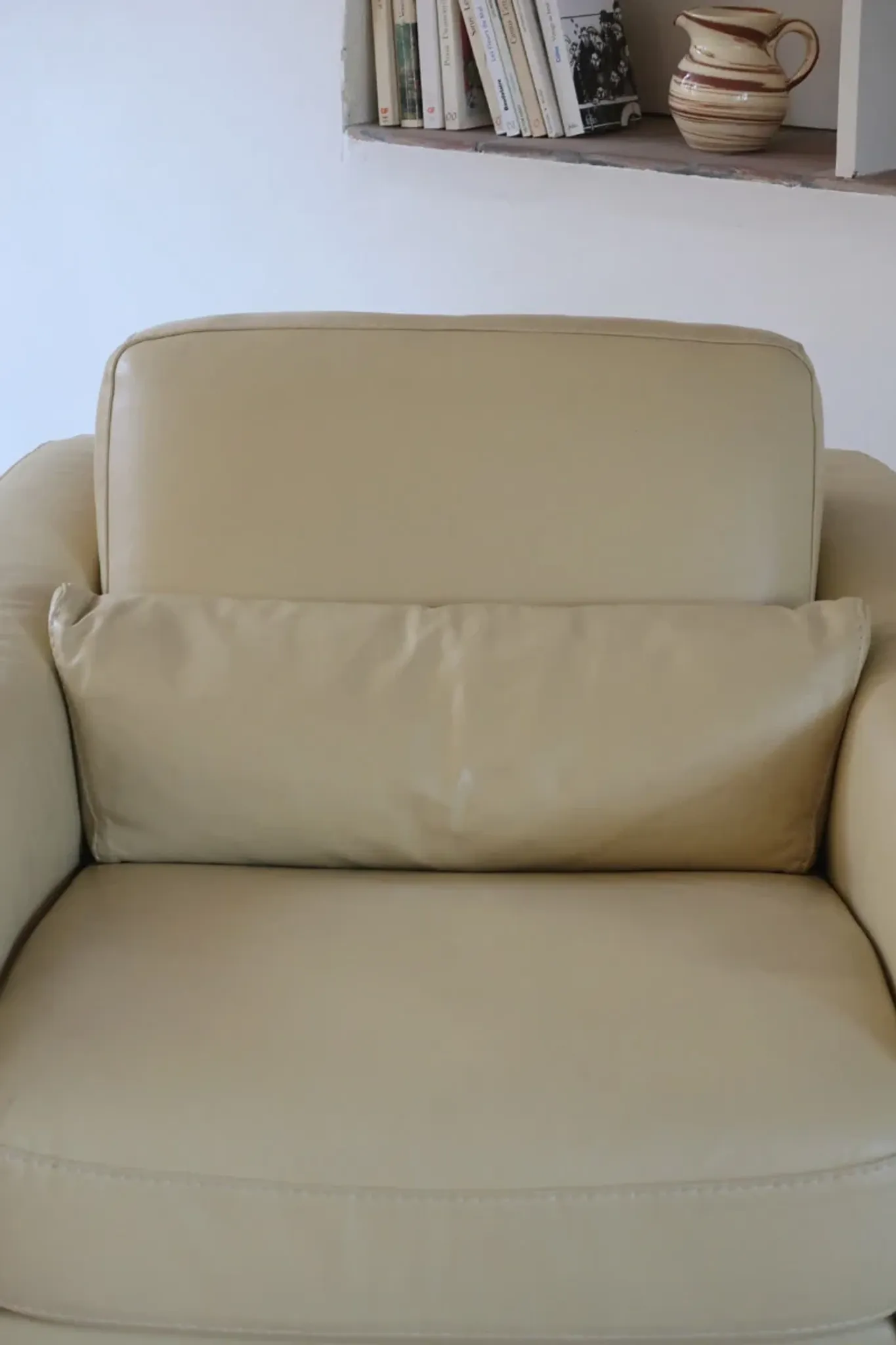 Vintage club armchair in butter yellow faux leather from the 1980s.