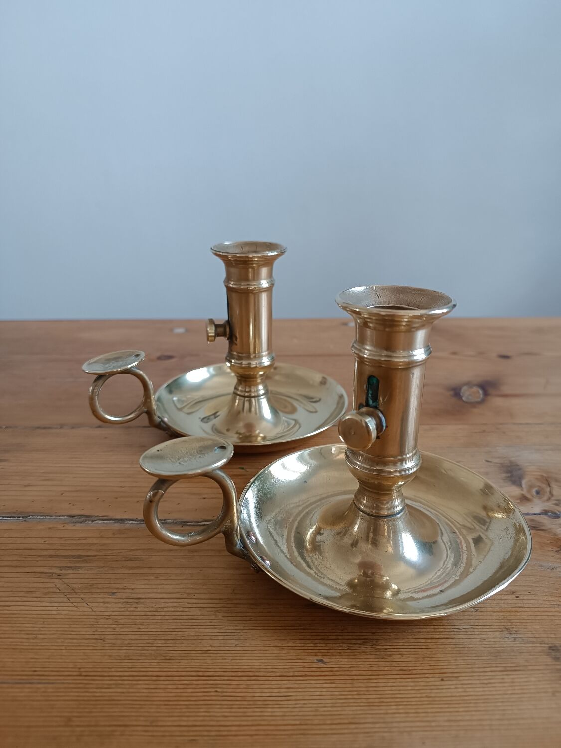 Duo of gilded brass cellar rat candlesticks
