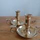 Duo of gilded brass cellar rat candlesticks