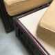 Rattan armchair and footrest