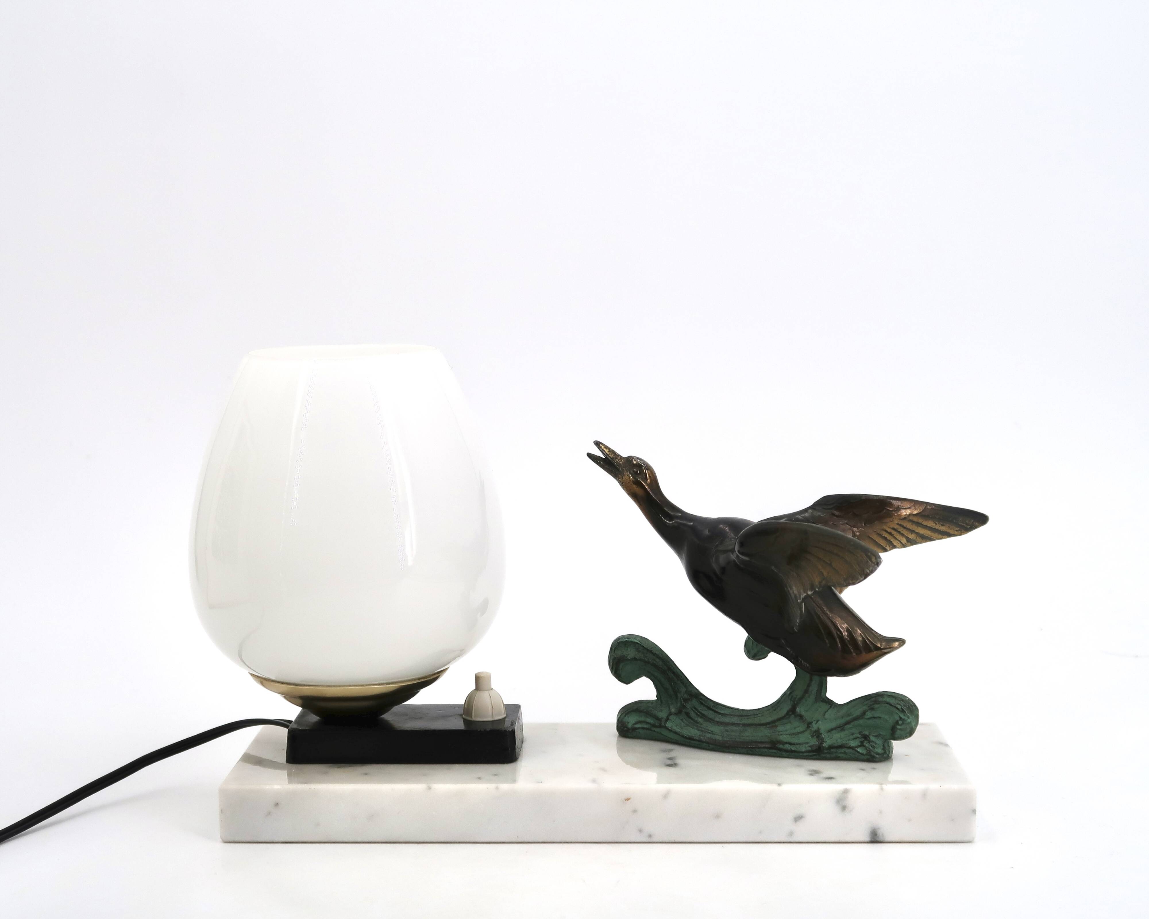 Art Deco lamp decorated with a flying duck, marble base, 1930s.