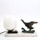 Art Deco lamp decorated with a flying duck, marble base, 1930s.