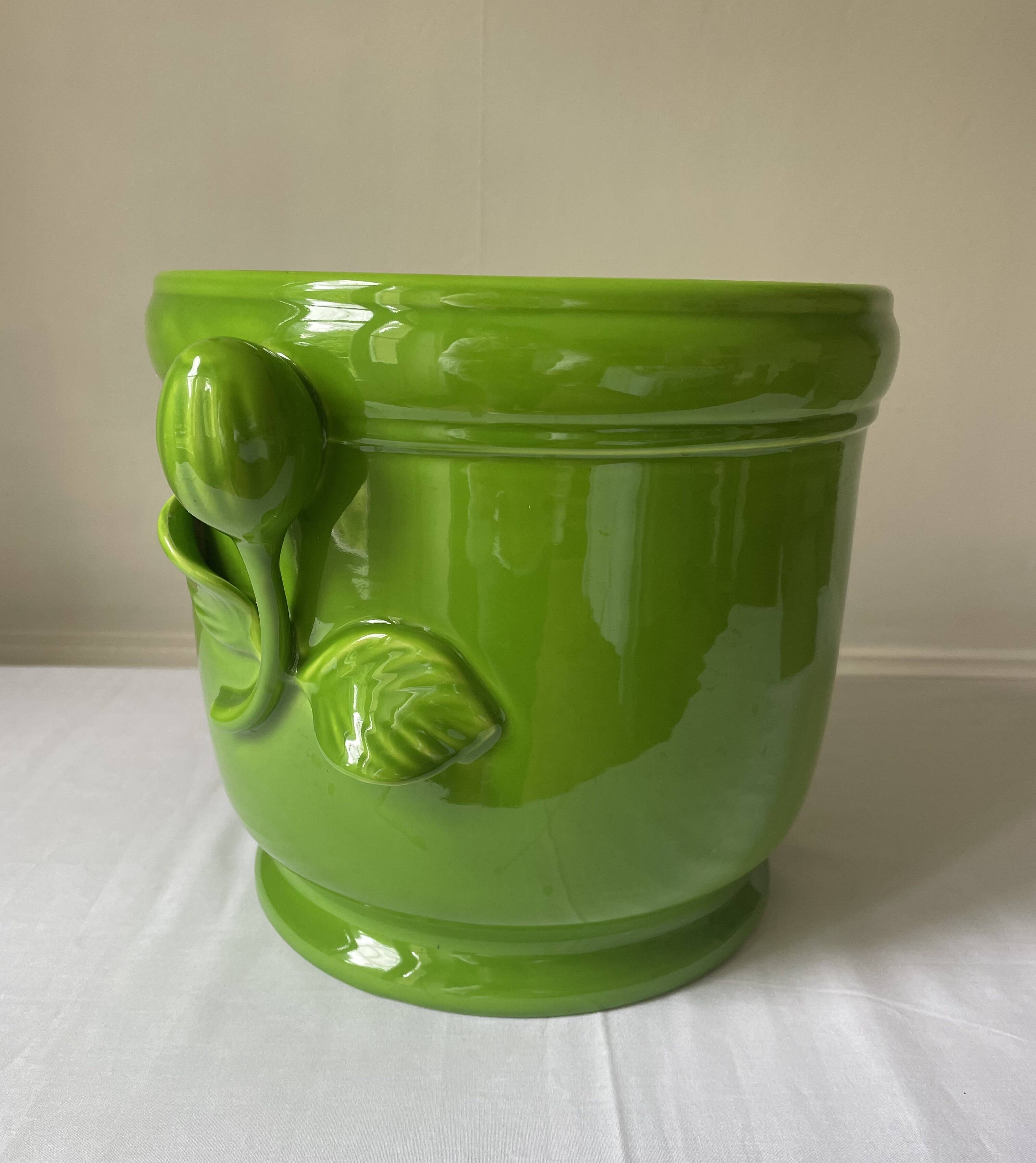 Glazed green pot cover in the style of Moreau Bourg earthenware
