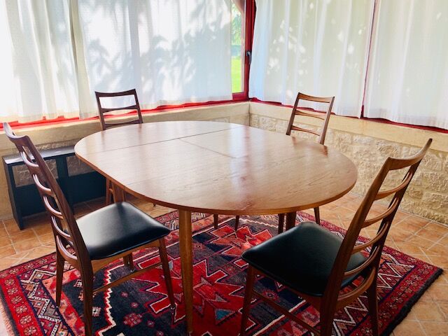 Expandable teak dining table, butterfly extension, circa 60s