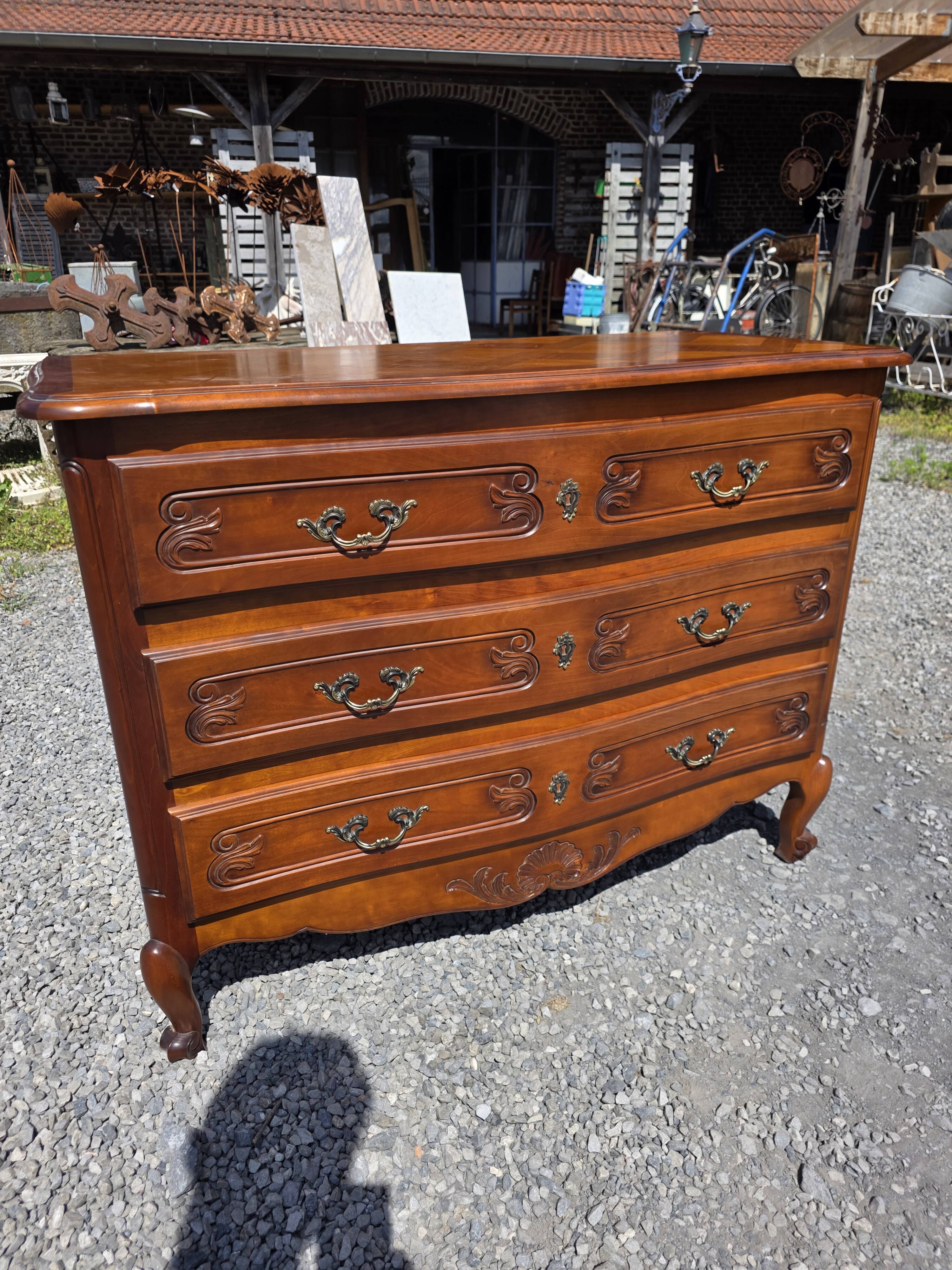 Curved commode in Louis XV style made of cherry wood.