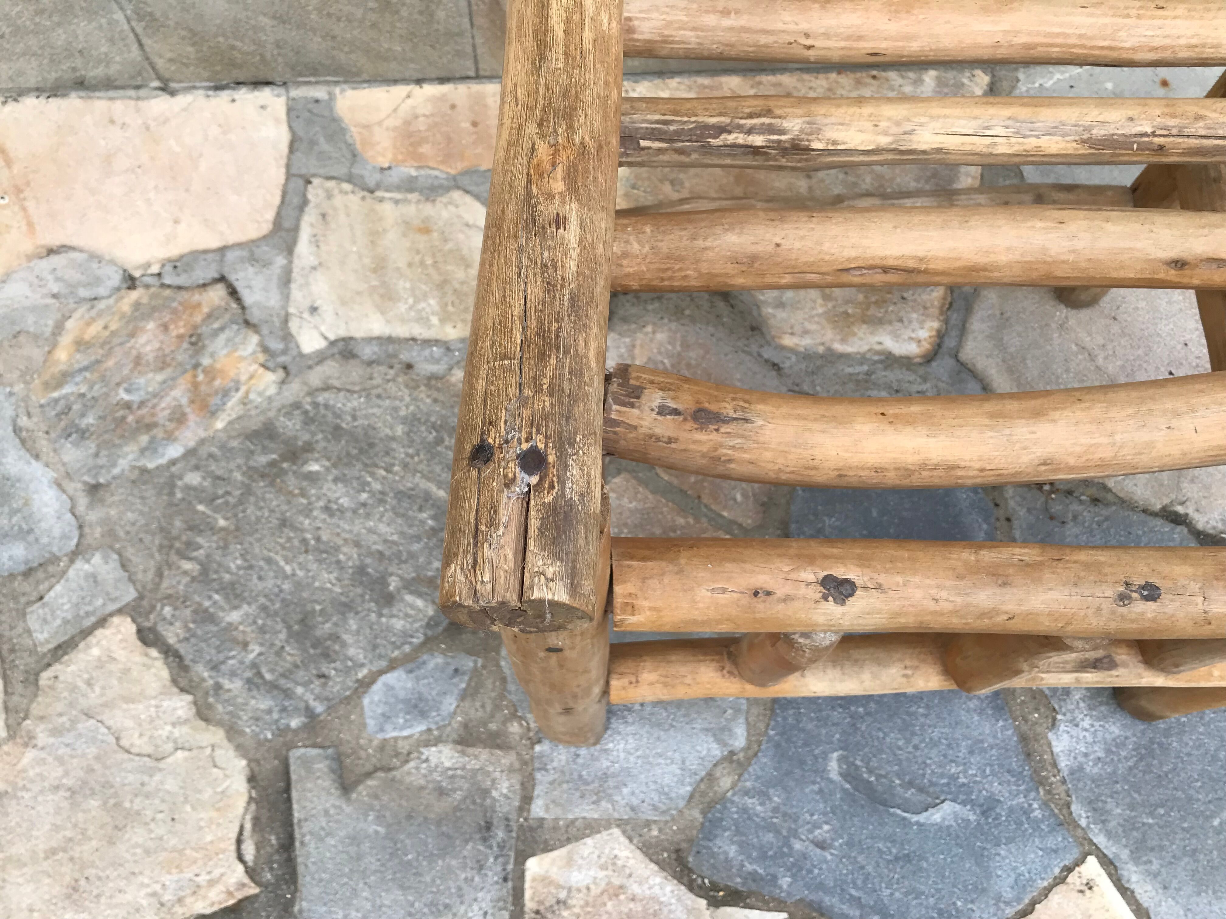 Art-Populaire armchair in raw wood, circa 1950.