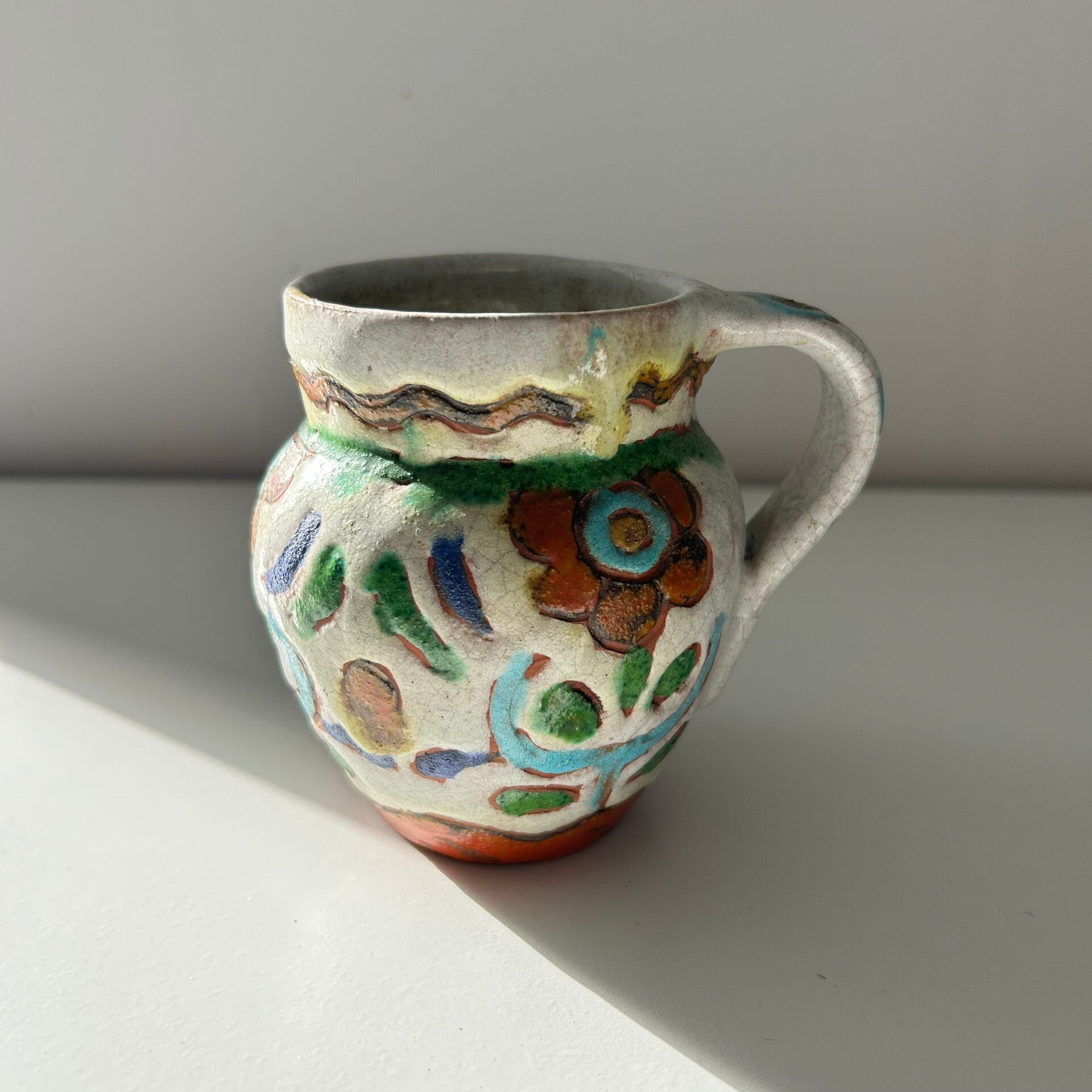 Small floral jug signed