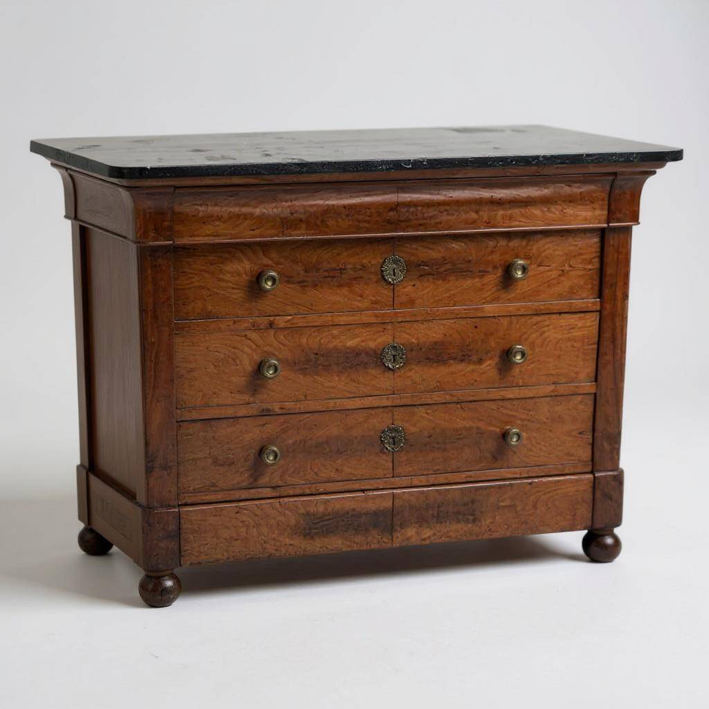 Chest of drawers in walnut and walnut veneer with black veined marble top
