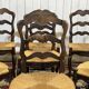 Set of 7 Louis XV style beech chairs with straw seats.