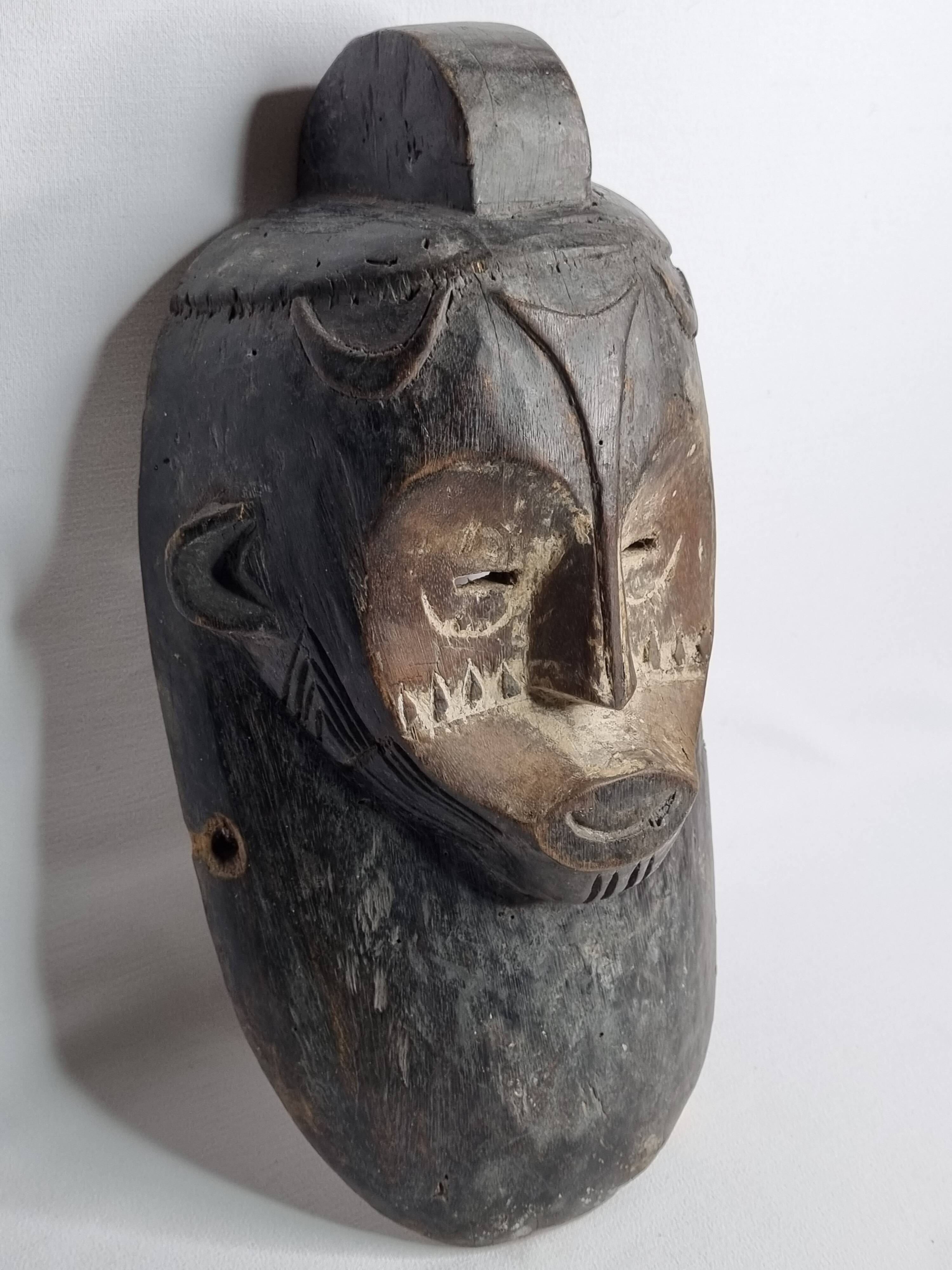 Ancient Fang Ngil tribal mask, traditional African art, Gabon, 20th century, 40 cm
