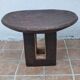African monoxyle side table in carved wood with a curved top, 48x36 cm.