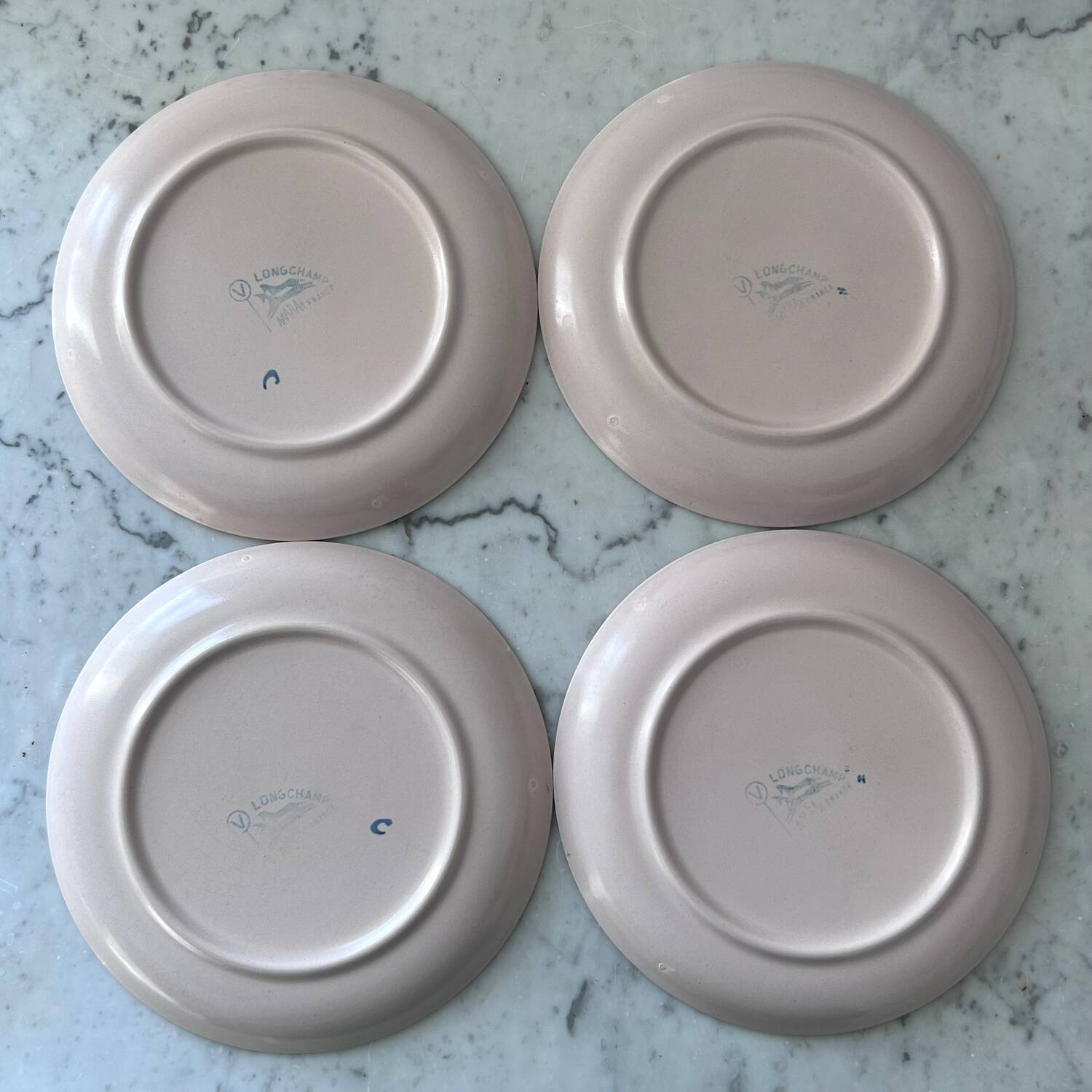 Set of 4 stamped Longchamp plates