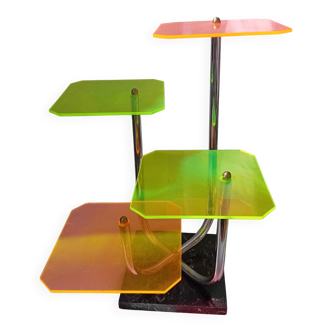 Display shelf with plexiglass trays in 1970s colours.