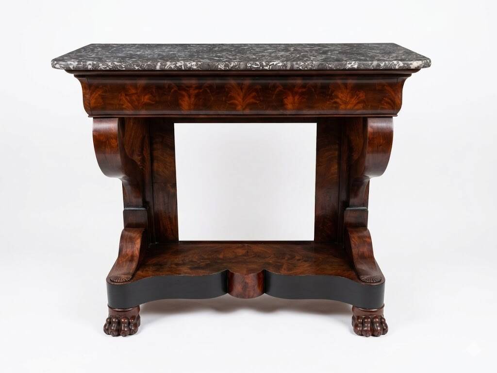 Mahogany console with grey marble top and lion paw feet.