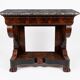 Mahogany console with grey marble top and lion paw feet.