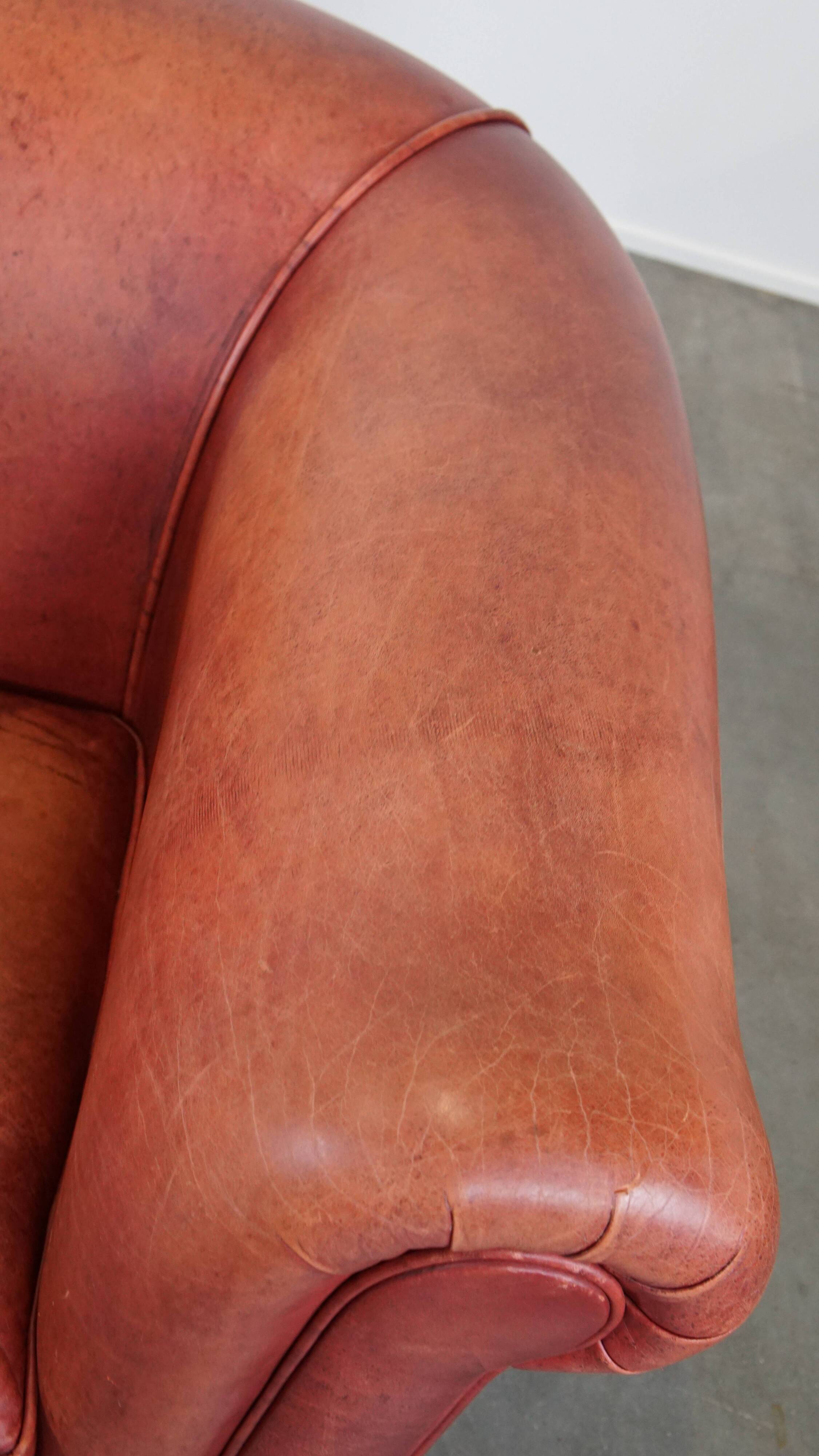 English Chesterfield club chair in light red cowhide leather