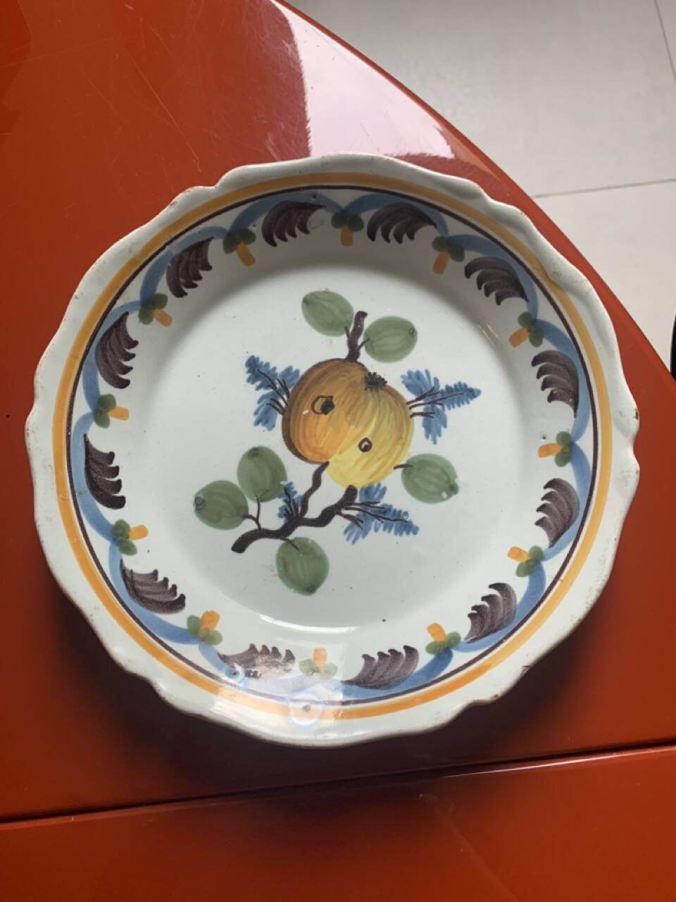 Antique earthenware soup plate with plum decoration