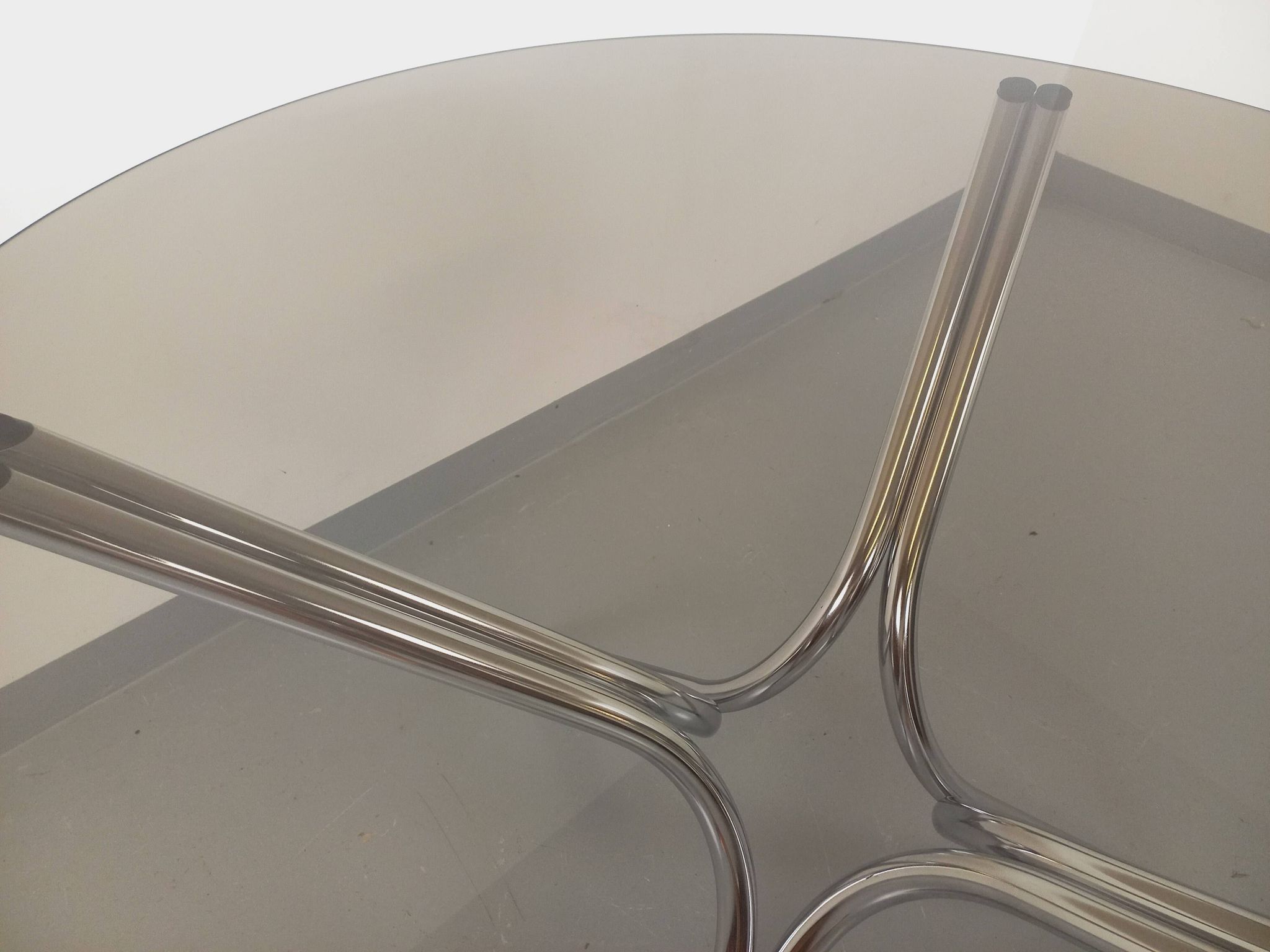 Vintage round dining table in smoked glass and chromed metal, Space Age style, from the 70s