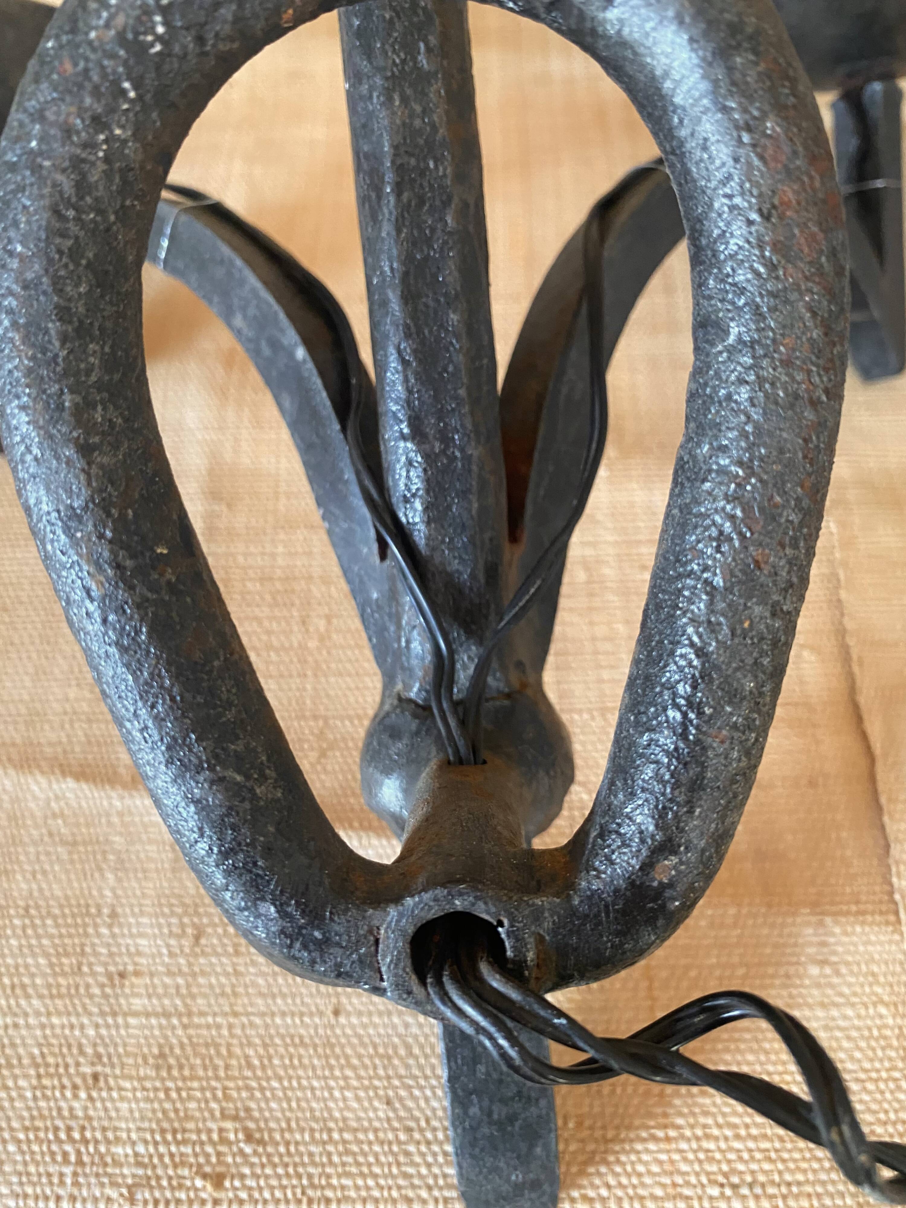 Wrought iron wall lights.