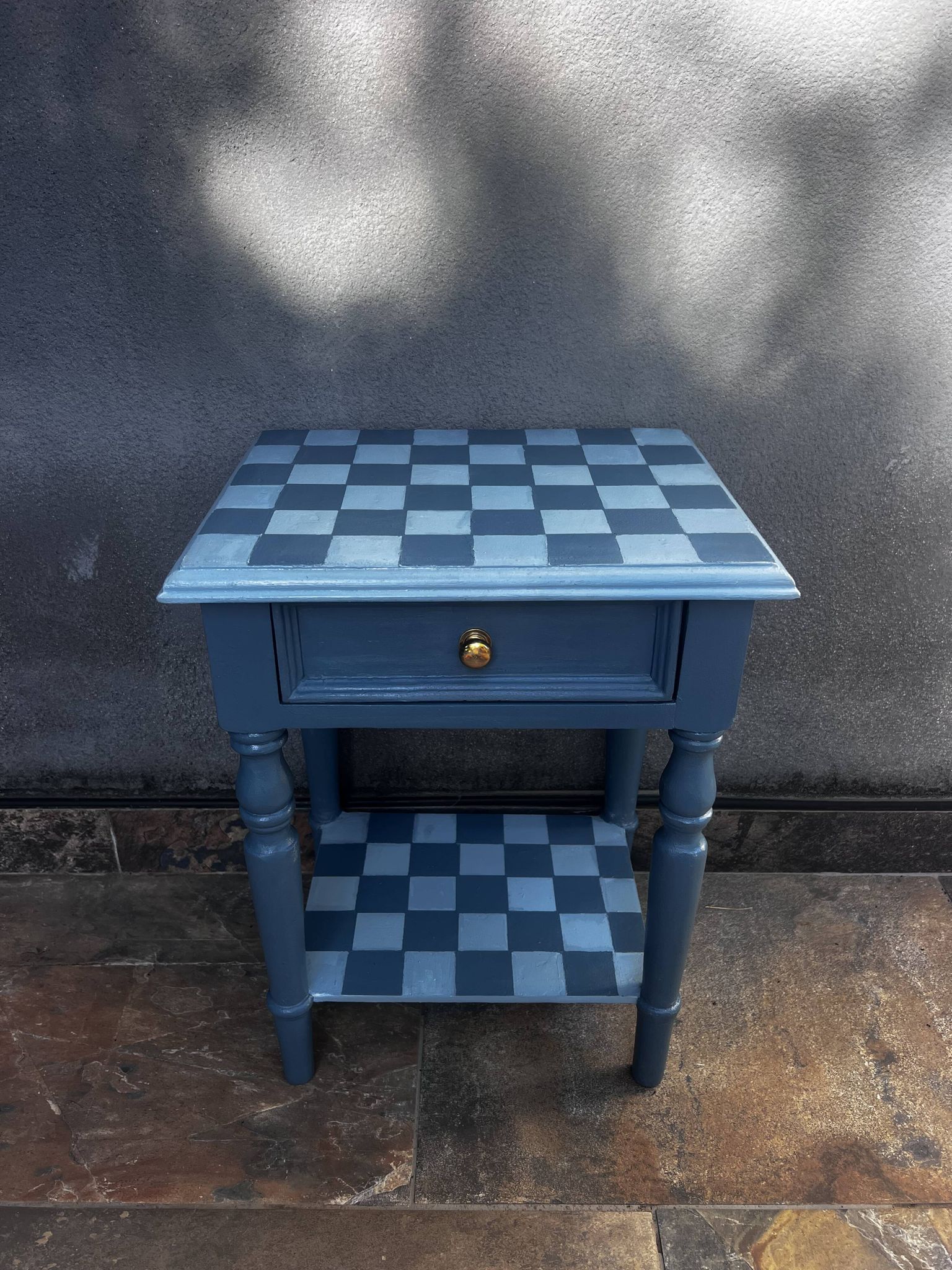 Blue checkered bedside table, neo-vintage style, turned legs.