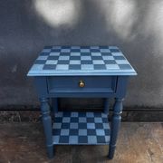 Blue checkered bedside table, neo-vintage style, turned legs.