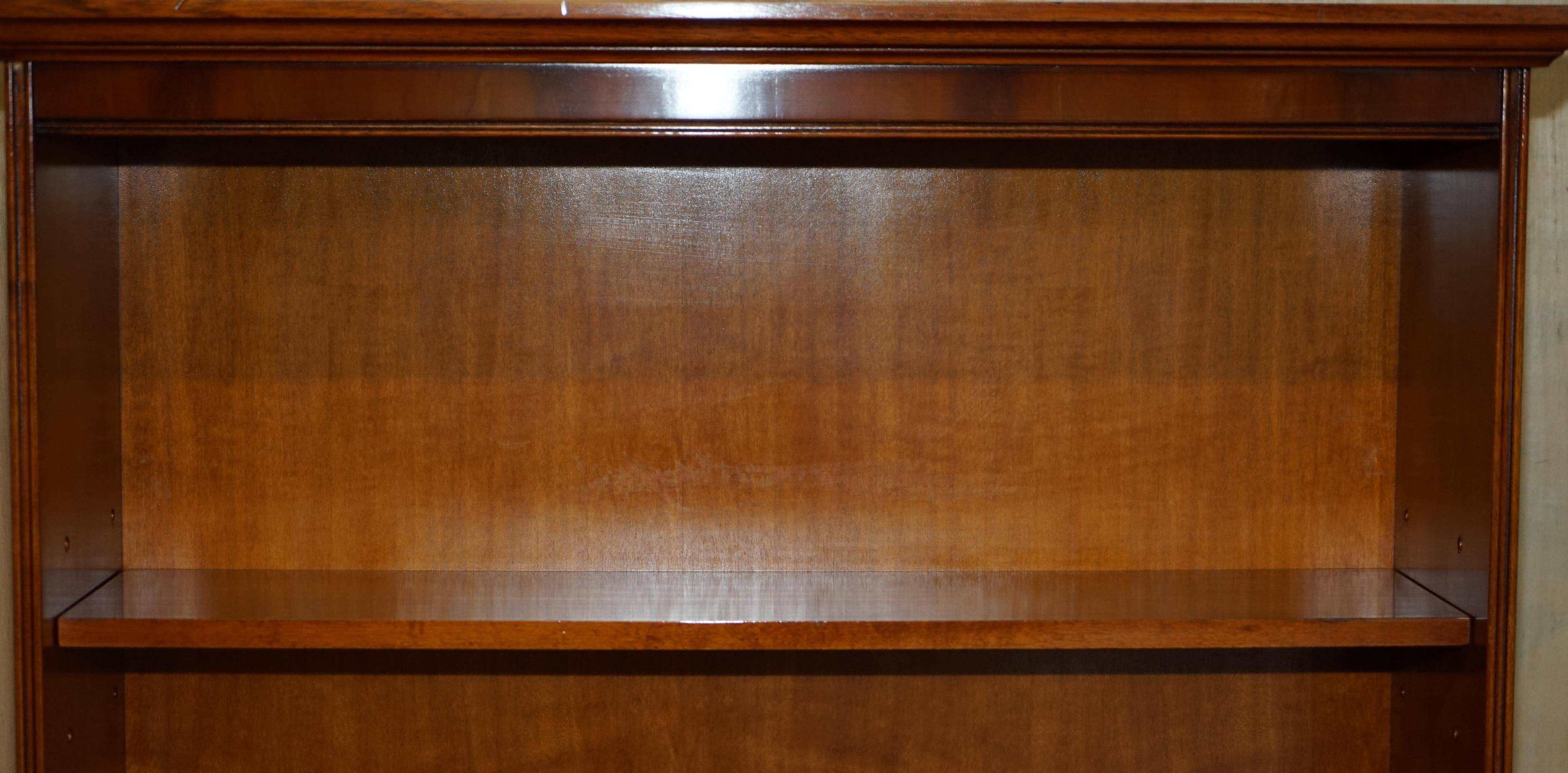 Open library Bradley Furniture made of yew wood with a cupboard base.