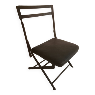 Old wrought iron folding children's chair. Early 20th century.