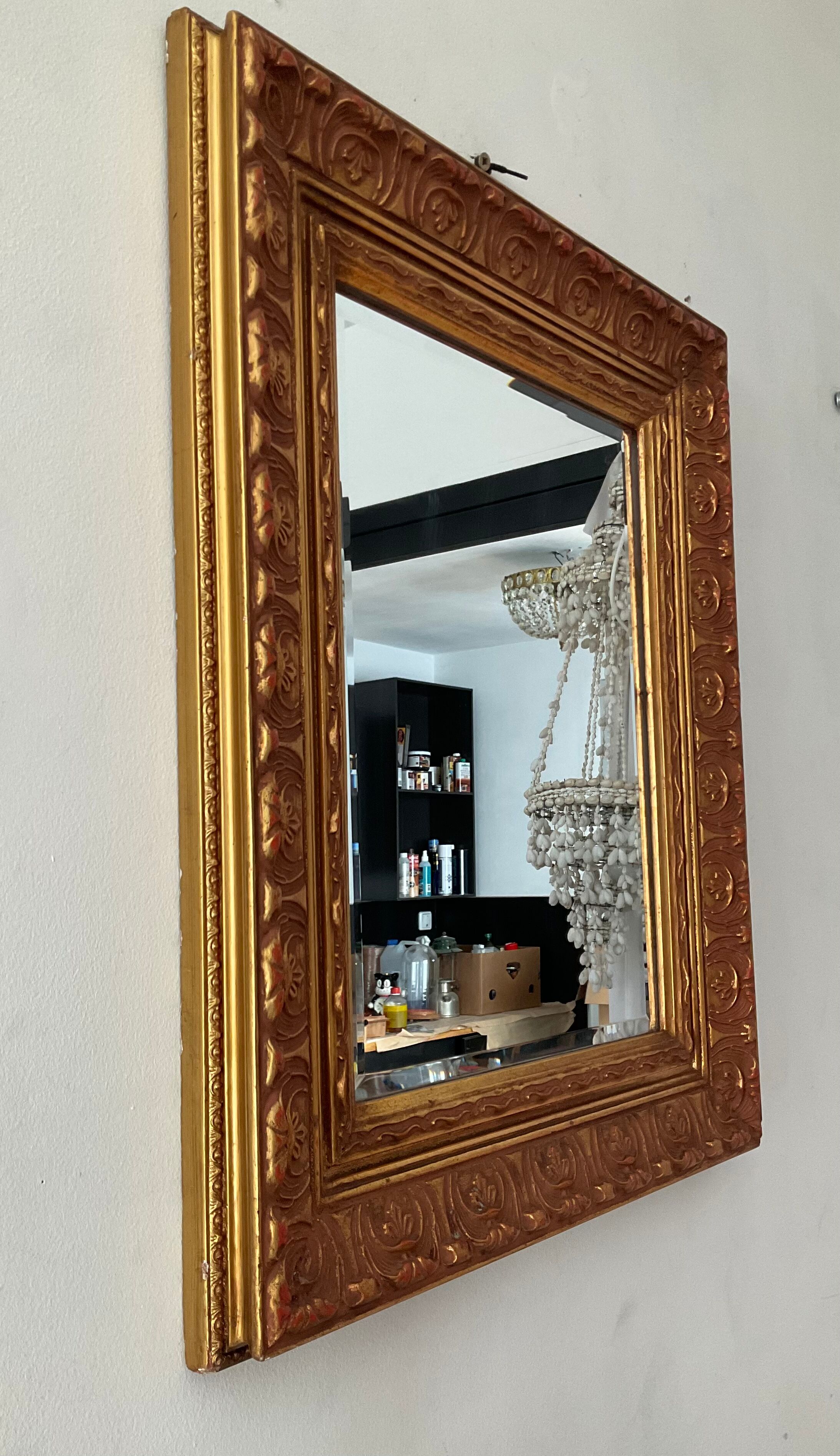 Old Beveled mirror in gilded wood