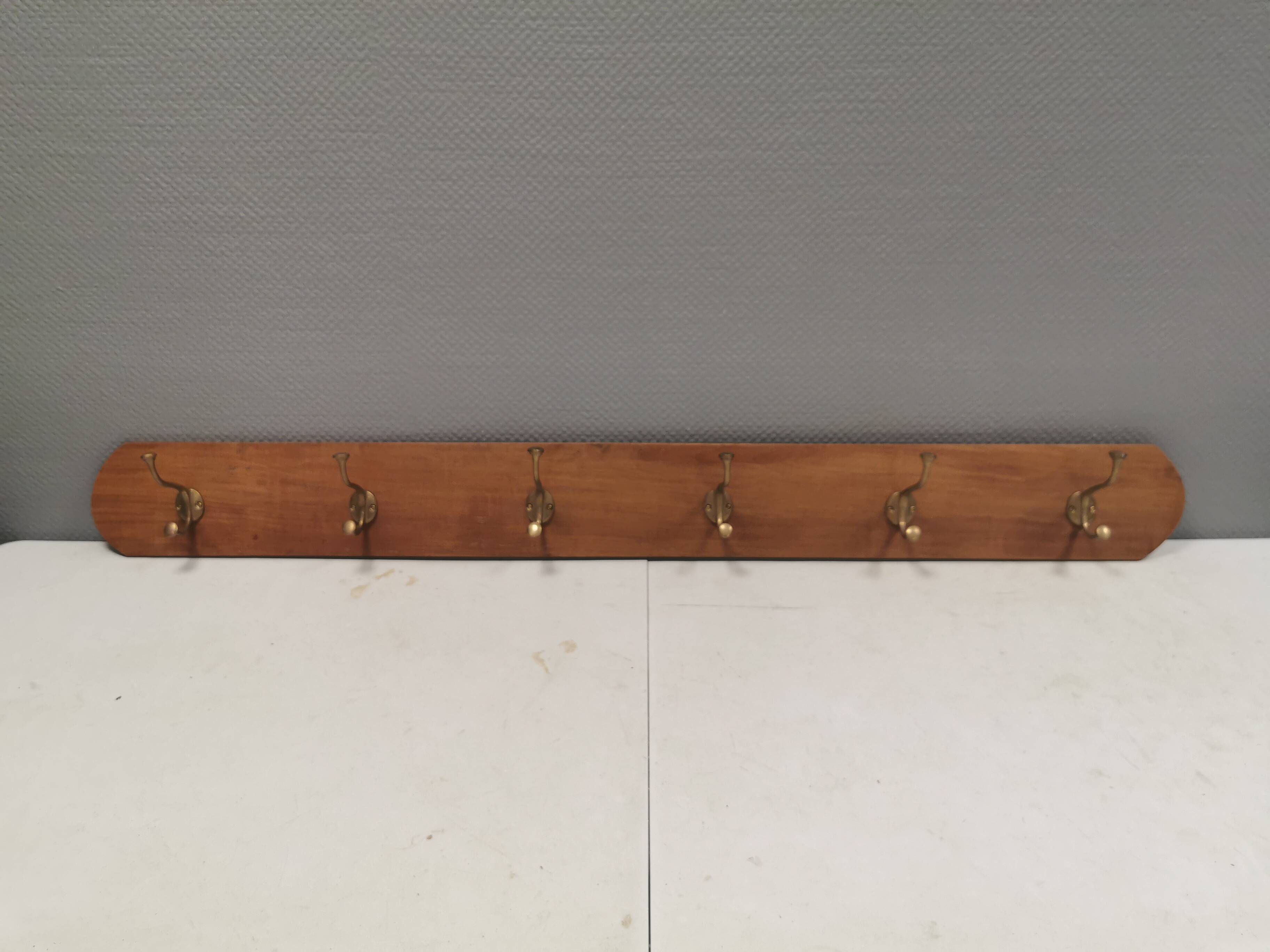 Coat rack in teak and brass. Denmark 1970-80s