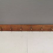 Coat rack in teak and brass. Denmark 1970-80s
