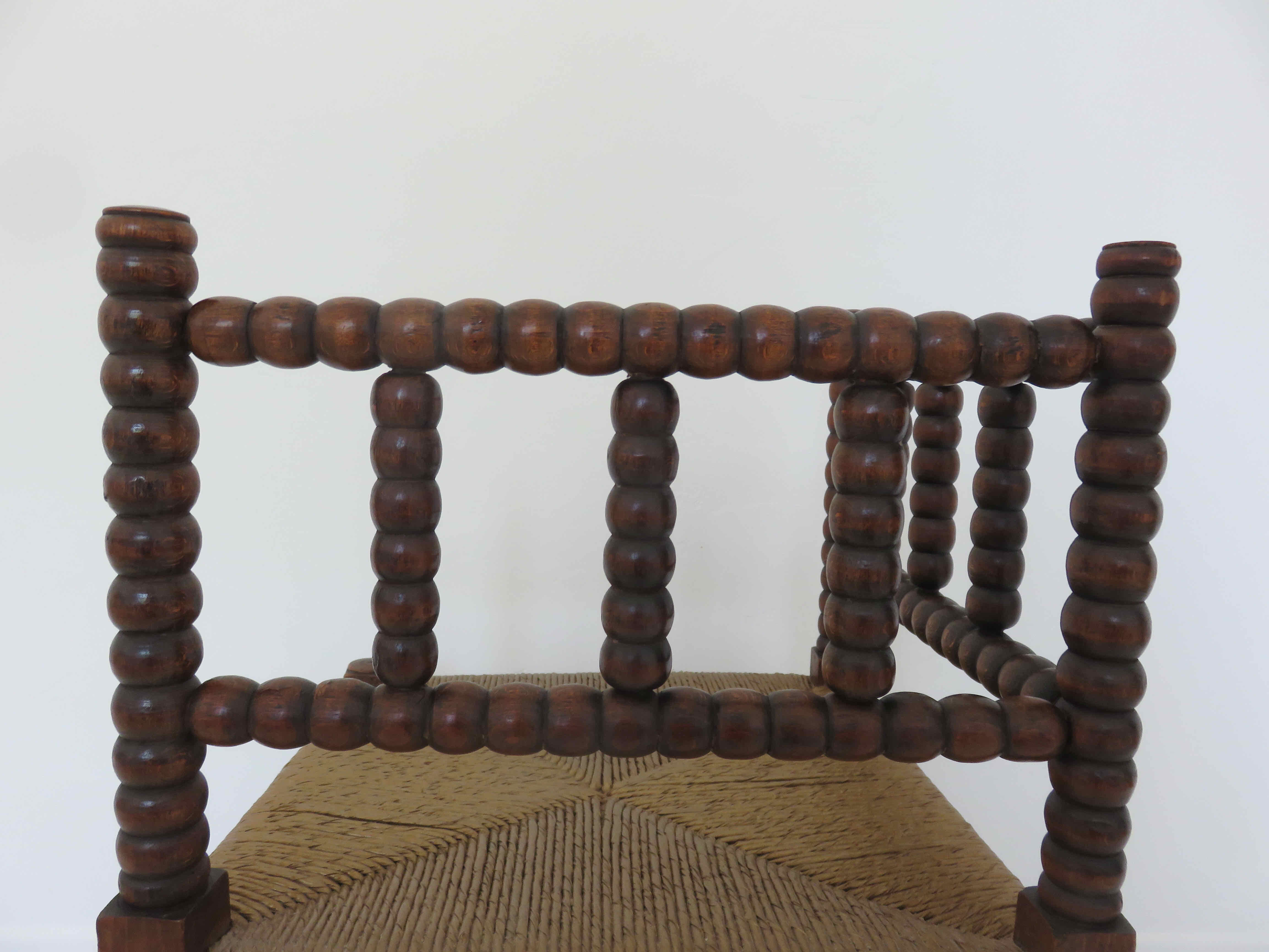 Corner chair in turned wood and straw