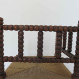 Corner chair in turned wood and straw