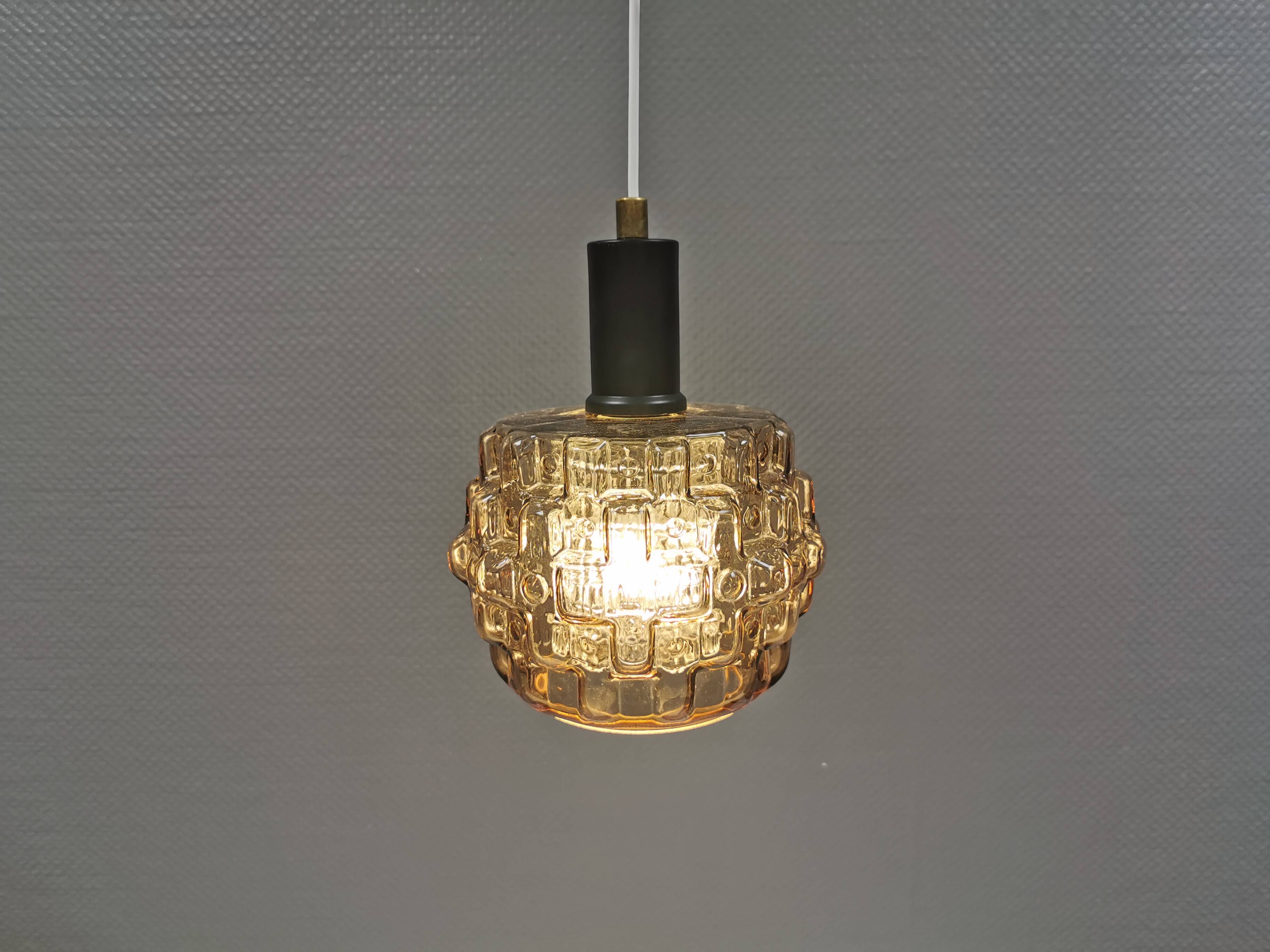 Older hanging lamp with champagne colored outer glass with inner shade of crystal glass.