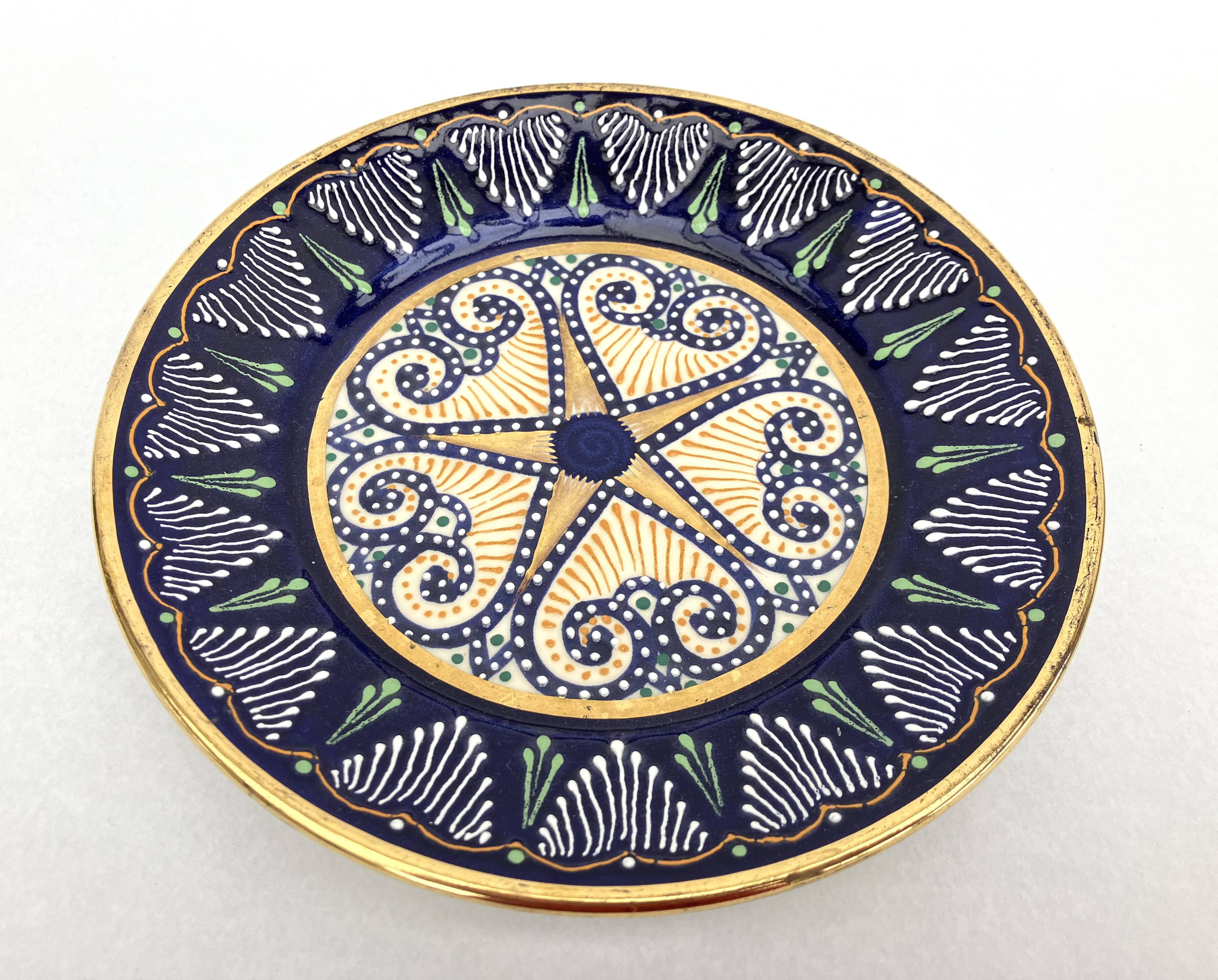 2 enamelled earthenware plates signed HB Quimper • Embroidery or beaded decoration by Pierre Poquet in relief