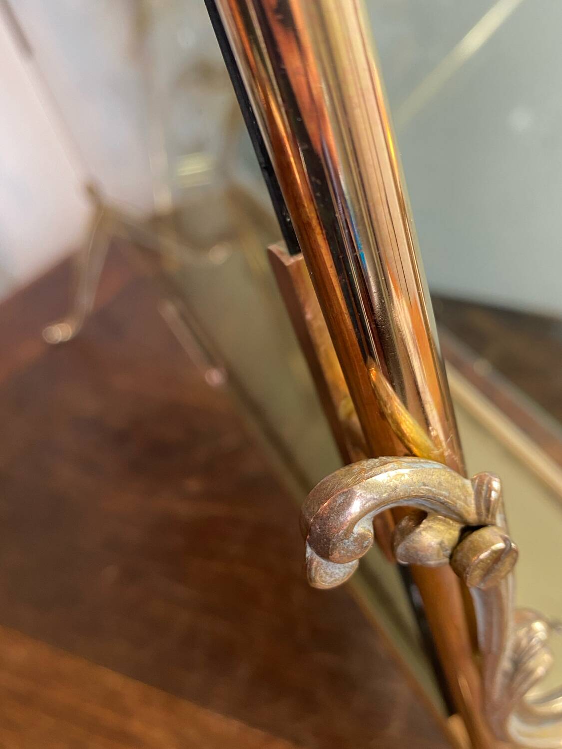 Brass magazine rack and blue-tinted glasses, 1950s.