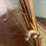 Brass magazine rack and blue-tinted glasses, 1950s.