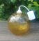 A vintage 70s blown glass pendant light with gold glitter in a globe shape