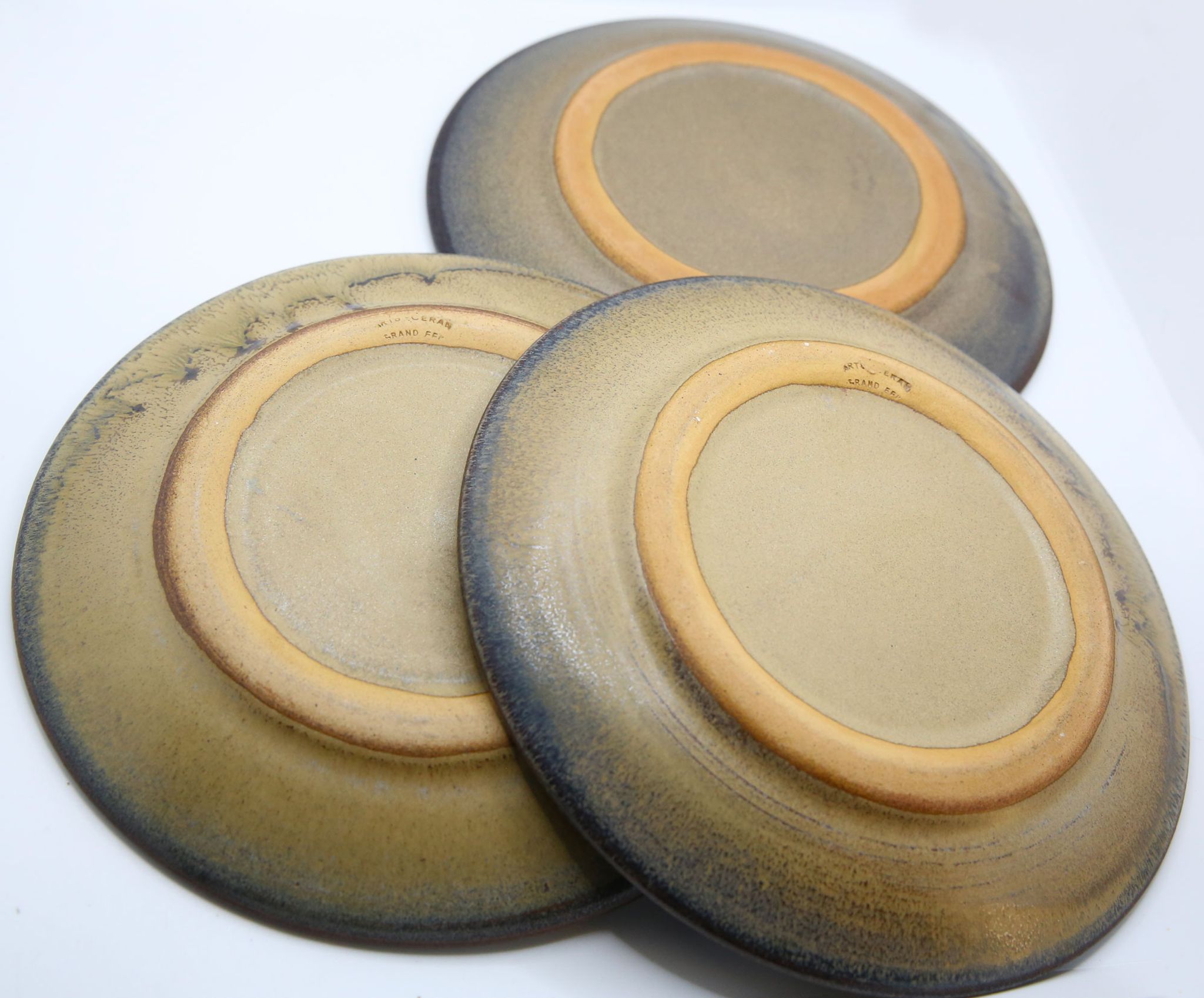 Set of 3 bluish and ochre plates in stoneware Arts Ceram Grand Feu