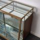 Counter or shop window in oak glass and brass France around 1920