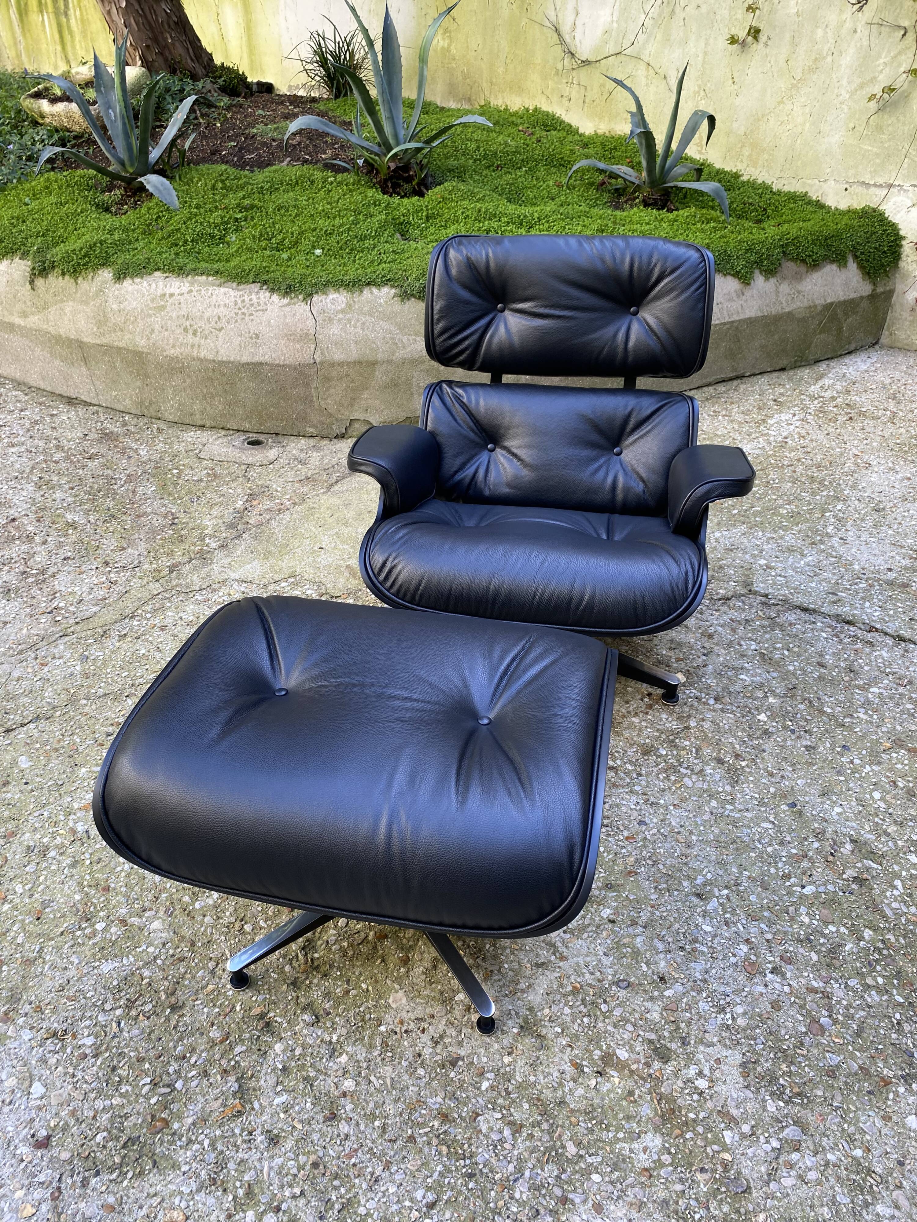Charles Eames all-black lounge chair and ottoman, Herman Miller edition