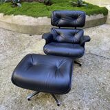 Charles Eames all-black lounge chair and ottoman, Herman Miller edition