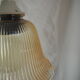Suspension in a ribbed tulip shape, made of smoked glass.